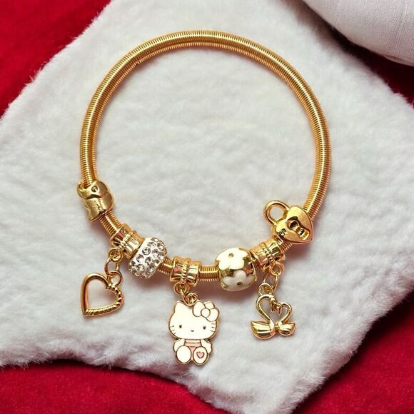 Hello Kitty White Heart Lock Swan Gold Tone Stretch Charm Bracelet - Picture 1 of 2